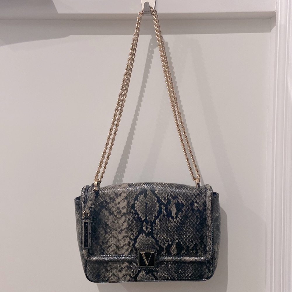 Vegan snakeskin style purse. Victoria Secrets. Comes with small lipstick mirror